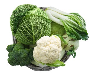 Wicker basket with different types of fresh cabbage on white background, top view