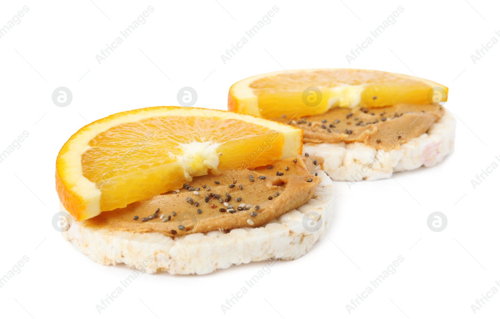 Photo of Puffed rice cakes with peanut butter and orange isolated on white