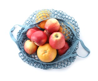 String bag with apples and oranges isolated on white, top view
