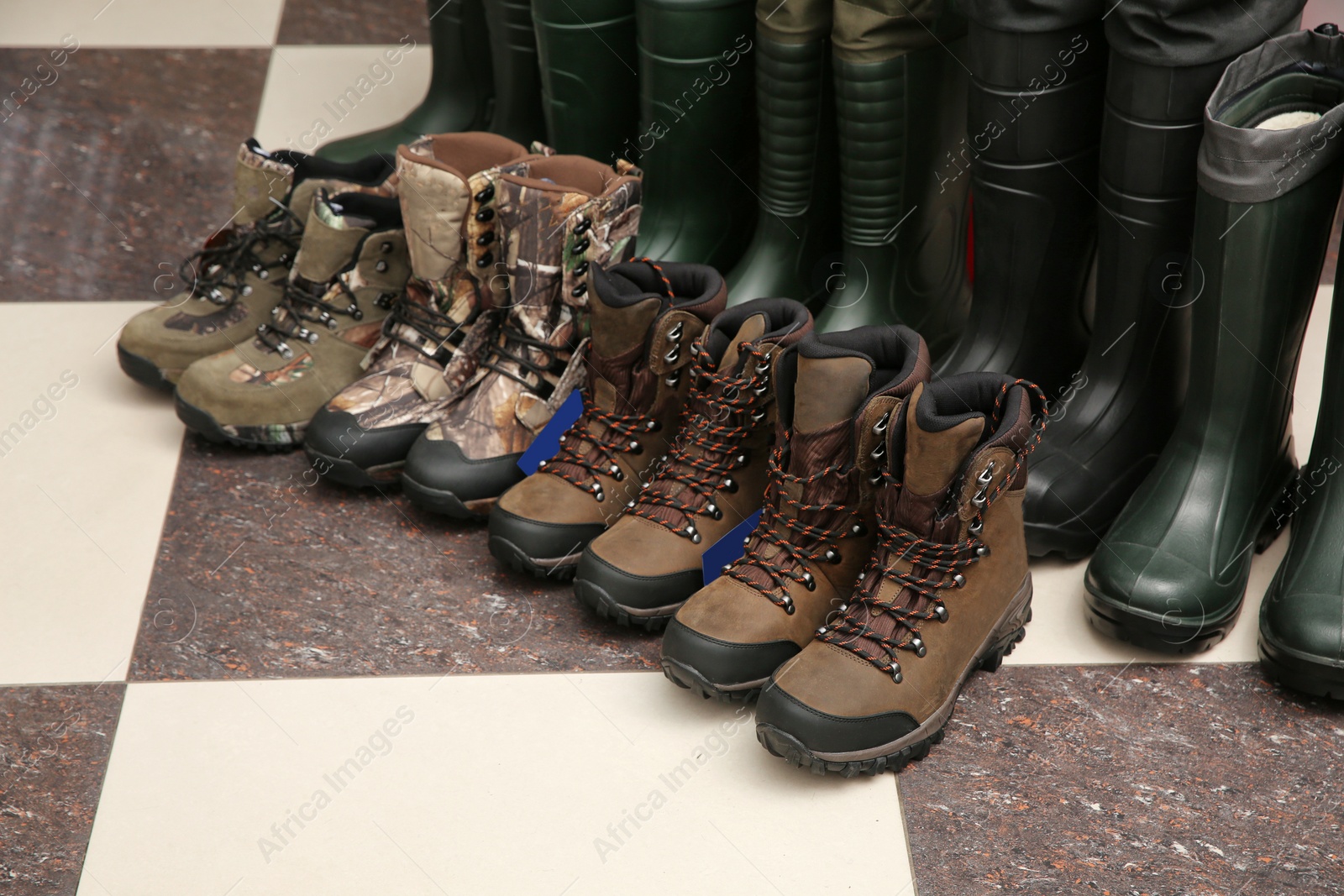 Photo of Footwear for fishing on floor in sports shop