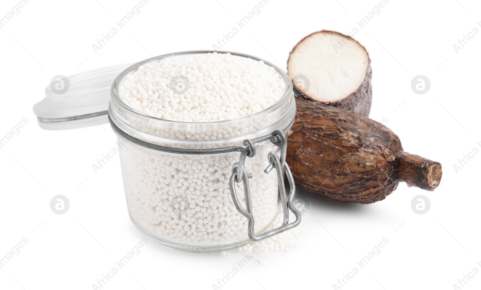 Photo of Tapioca pearls in jar and cassava roots isolated on white
