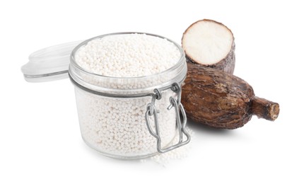 Tapioca pearls in jar and cassava roots isolated on white