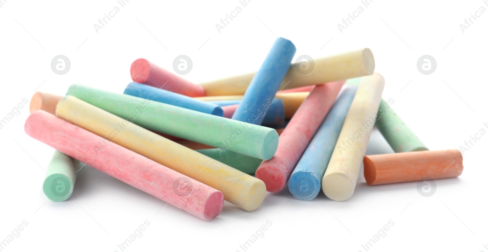 Photo of Color pieces of chalk on white background