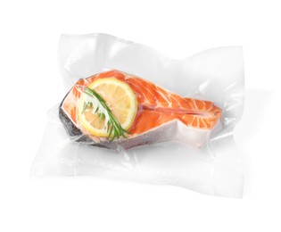 Photo of Salmon with lemon in vacuum pack on white background, top view