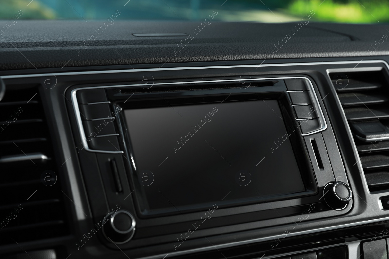 Photo of Closeup view of dashboard with navigation system in modern car