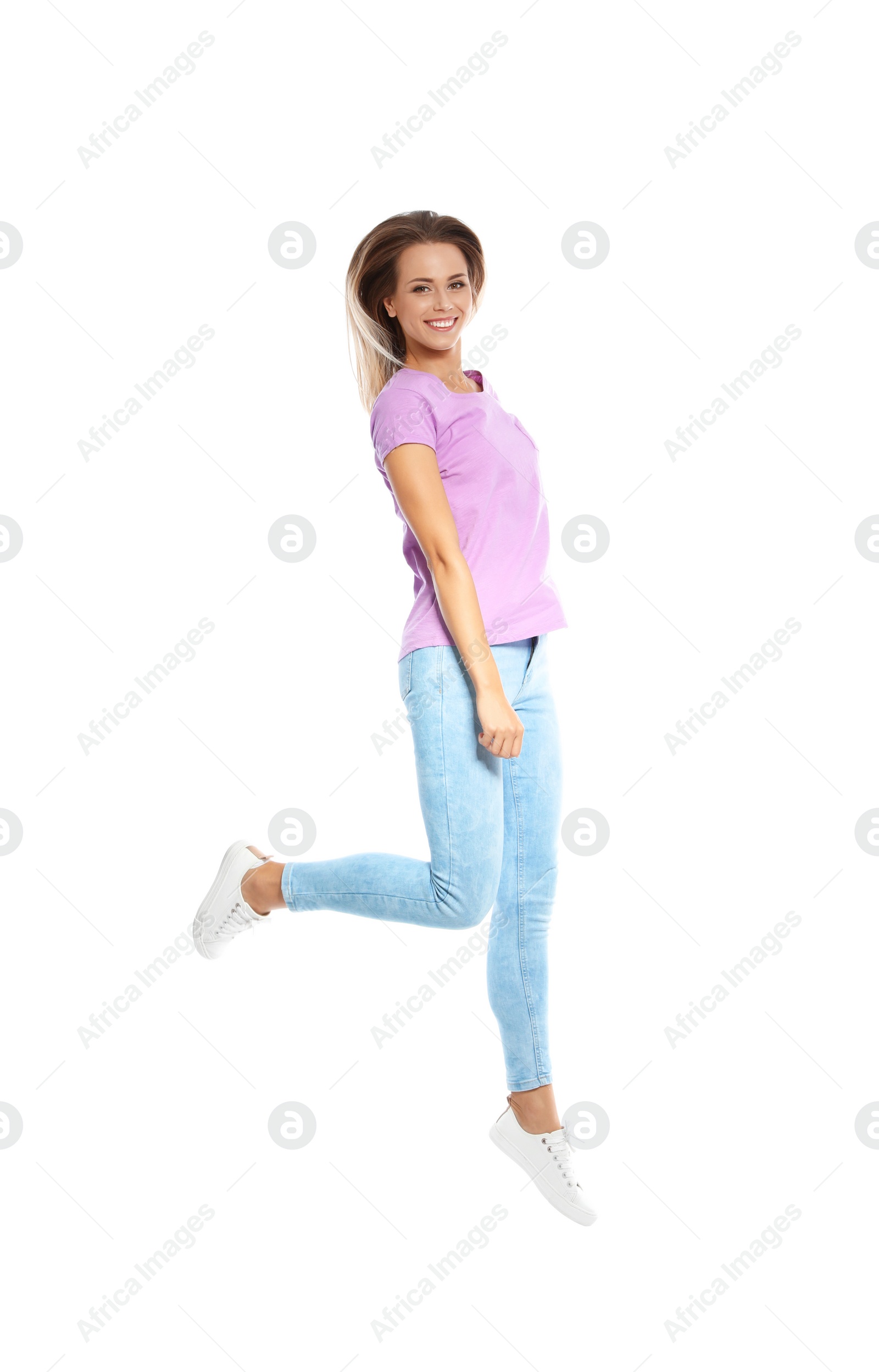 Photo of Beautiful woman jumping on white background