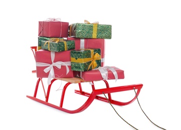 Sleigh with gift boxes on white background