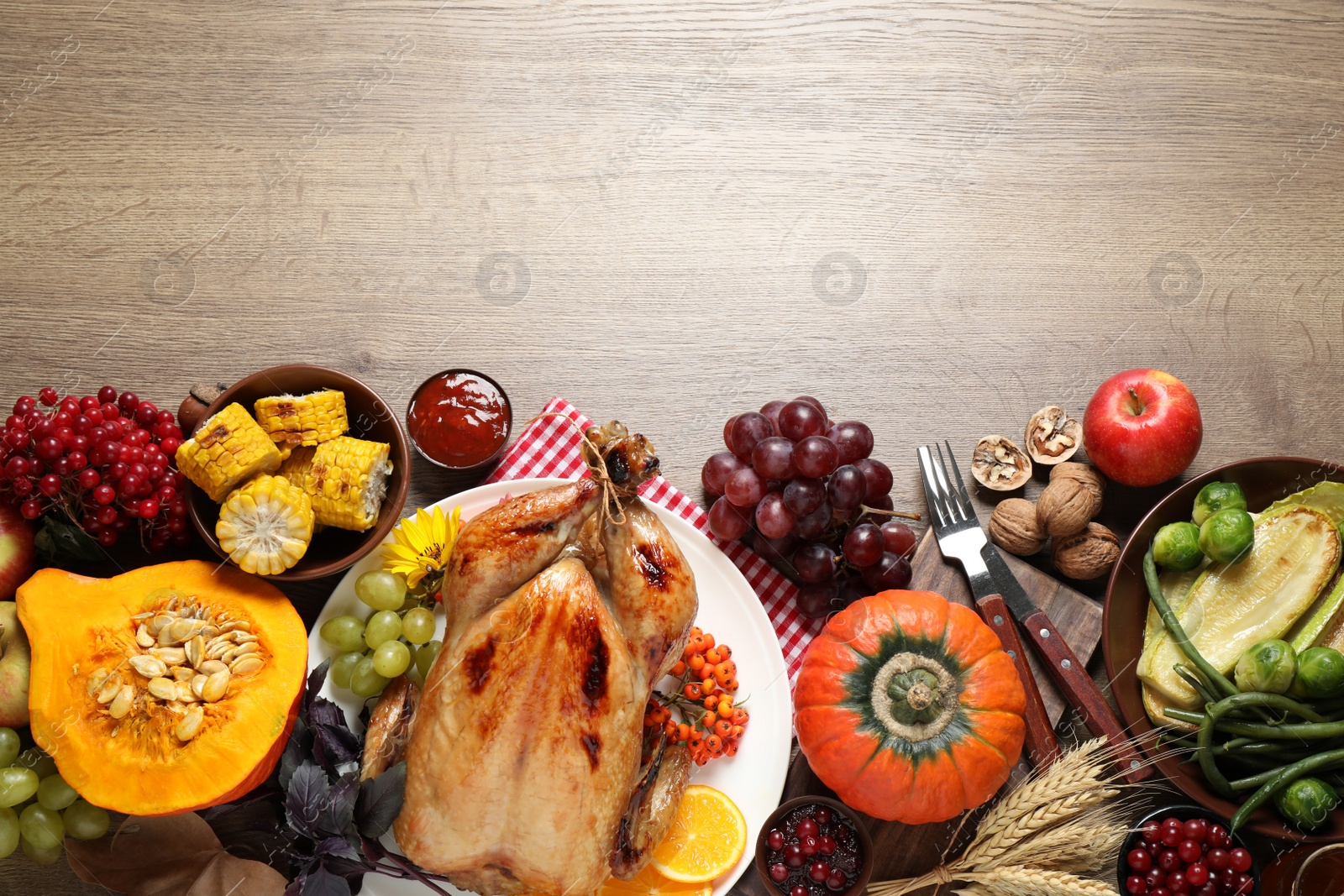 Photo of Flat lay composition with turkey on wooden background, space for text. Happy Thanksgiving day