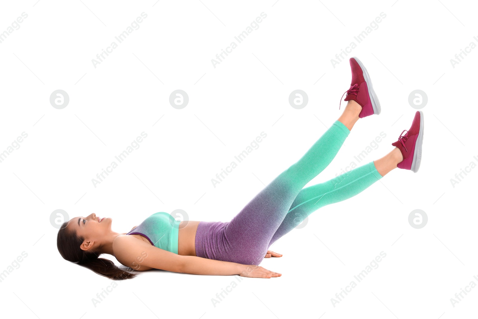 Photo of Young woman doing scissors exercise on white background