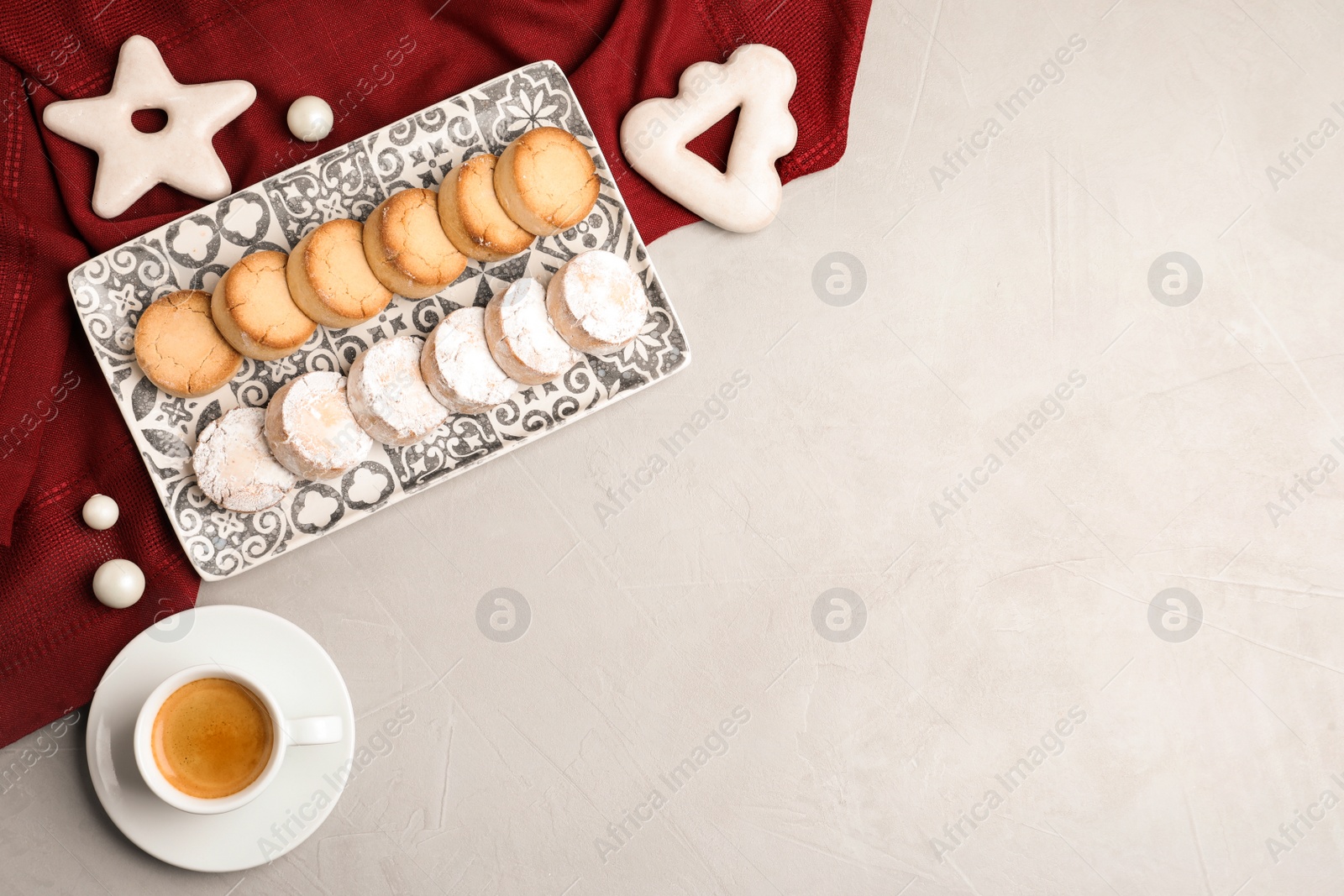 Photo of Flat lay composition with tasty cookies on light grey table, space for text