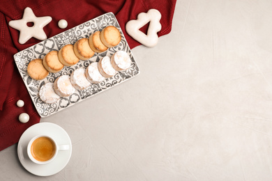 Photo of Flat lay composition with tasty cookies on light grey table, space for text