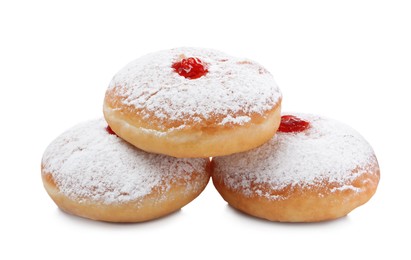 Photo of Delicious donuts with jelly and powdered sugar on white background
