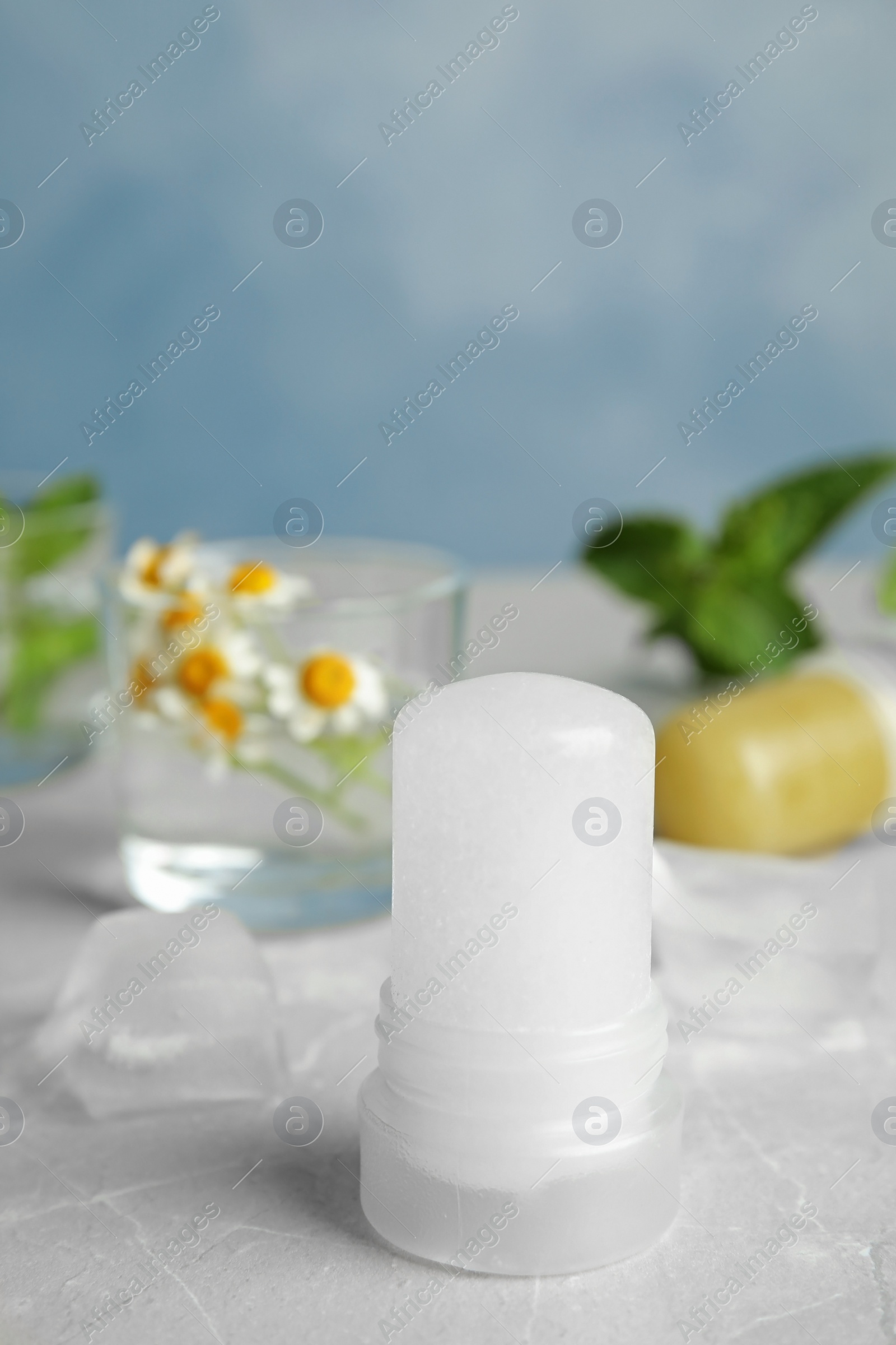 Photo of Natural crystal alum deodorant on light grey marble background