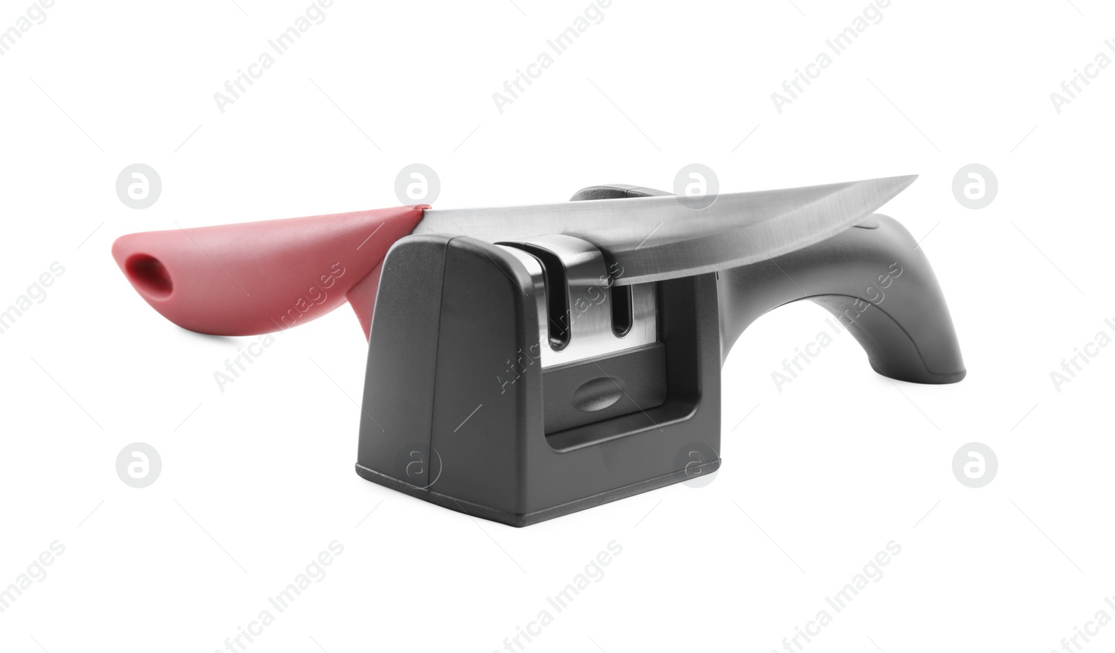 Photo of Modern handheld sharpener and knife on white background