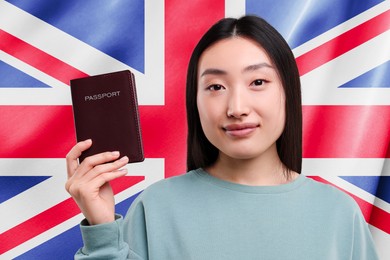 Immigration. Woman with passport against national flag of United Kingdom