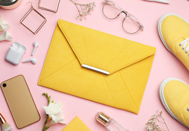 Photo of Flat lay composition with stylish woman's bag and accessories on pink background