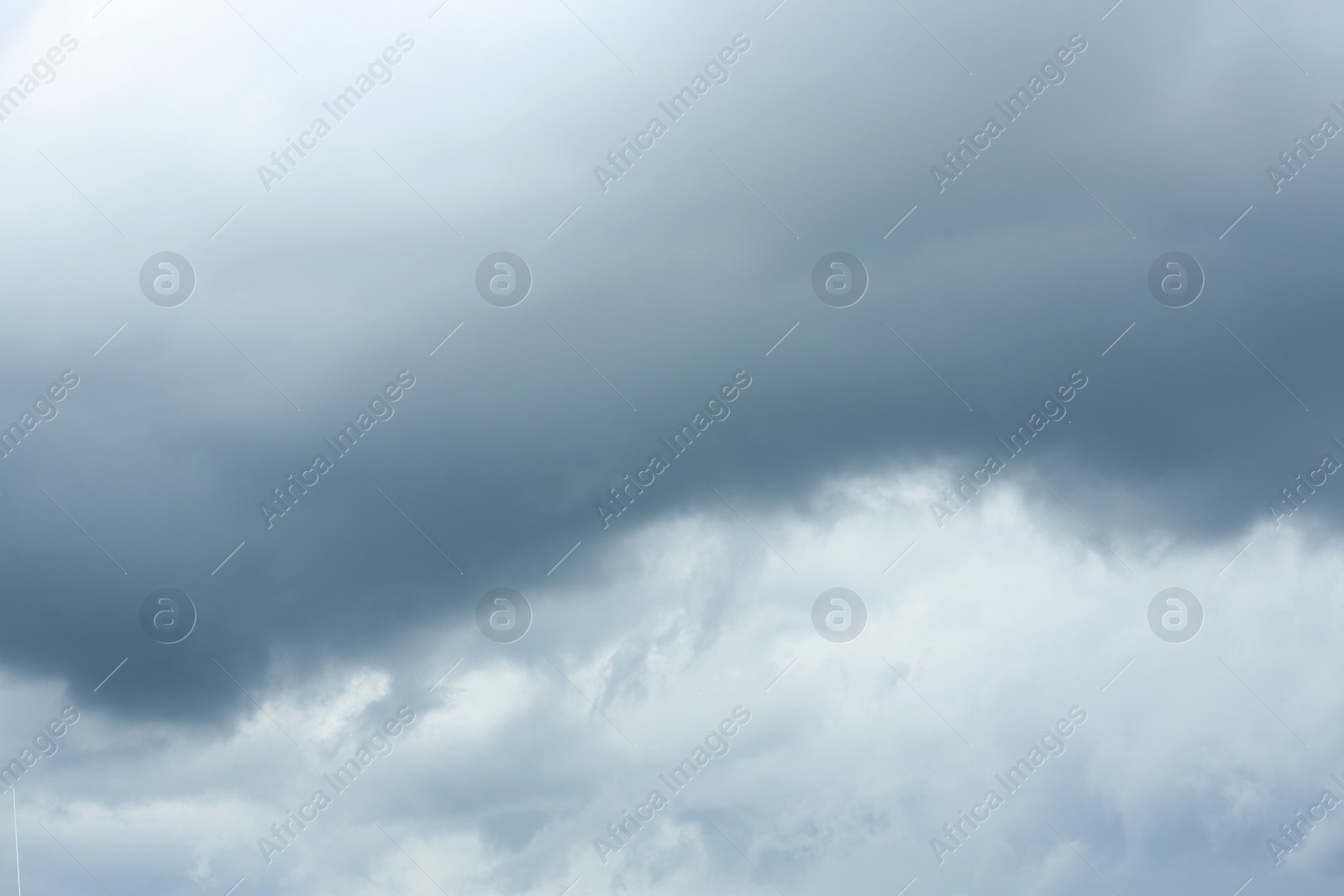 Photo of Sky with heavy rainy clouds on grey day