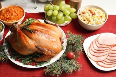 Photo of Traditional festive dinner with delicious roasted turkey served on table