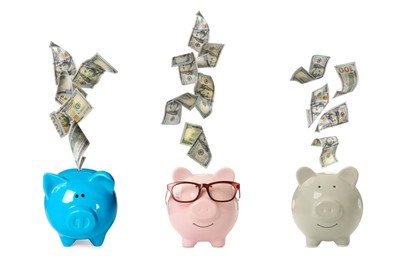 Money falling into different piggy banks on white background