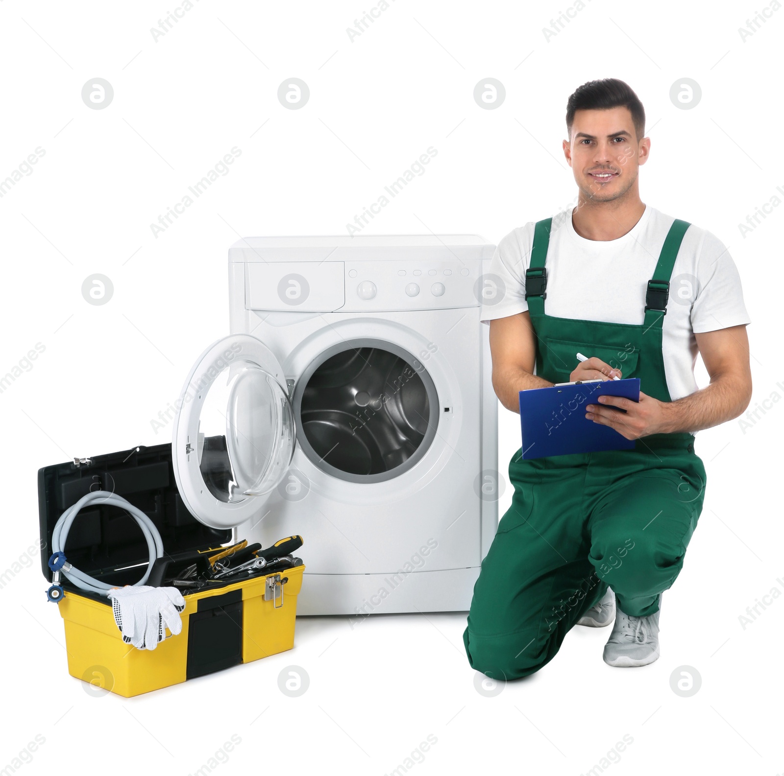 Photo of Repairman with clipboard and toolbox near washing machine on white background