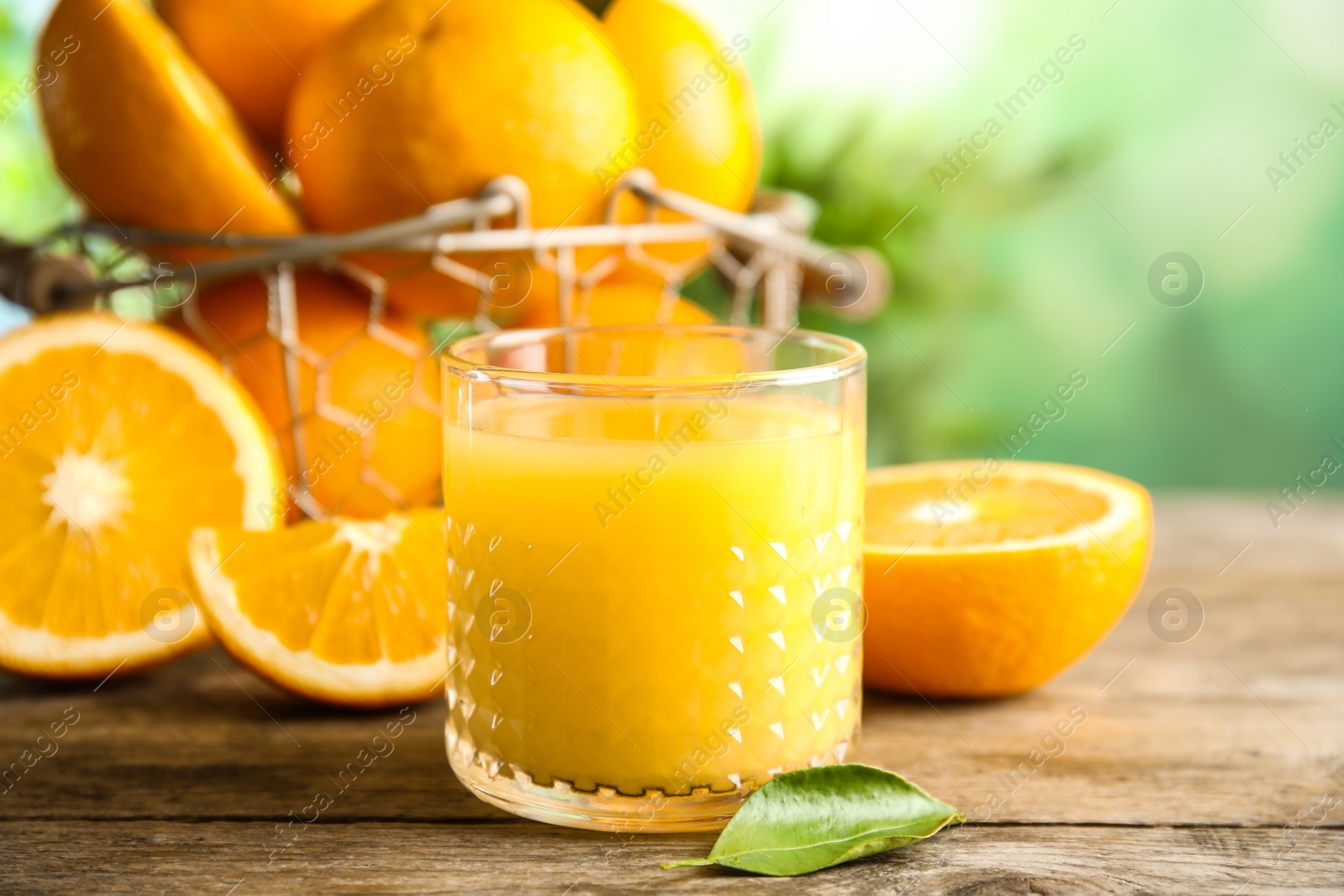 Photo of Composition with orange juice and fresh fruit on table, space for text