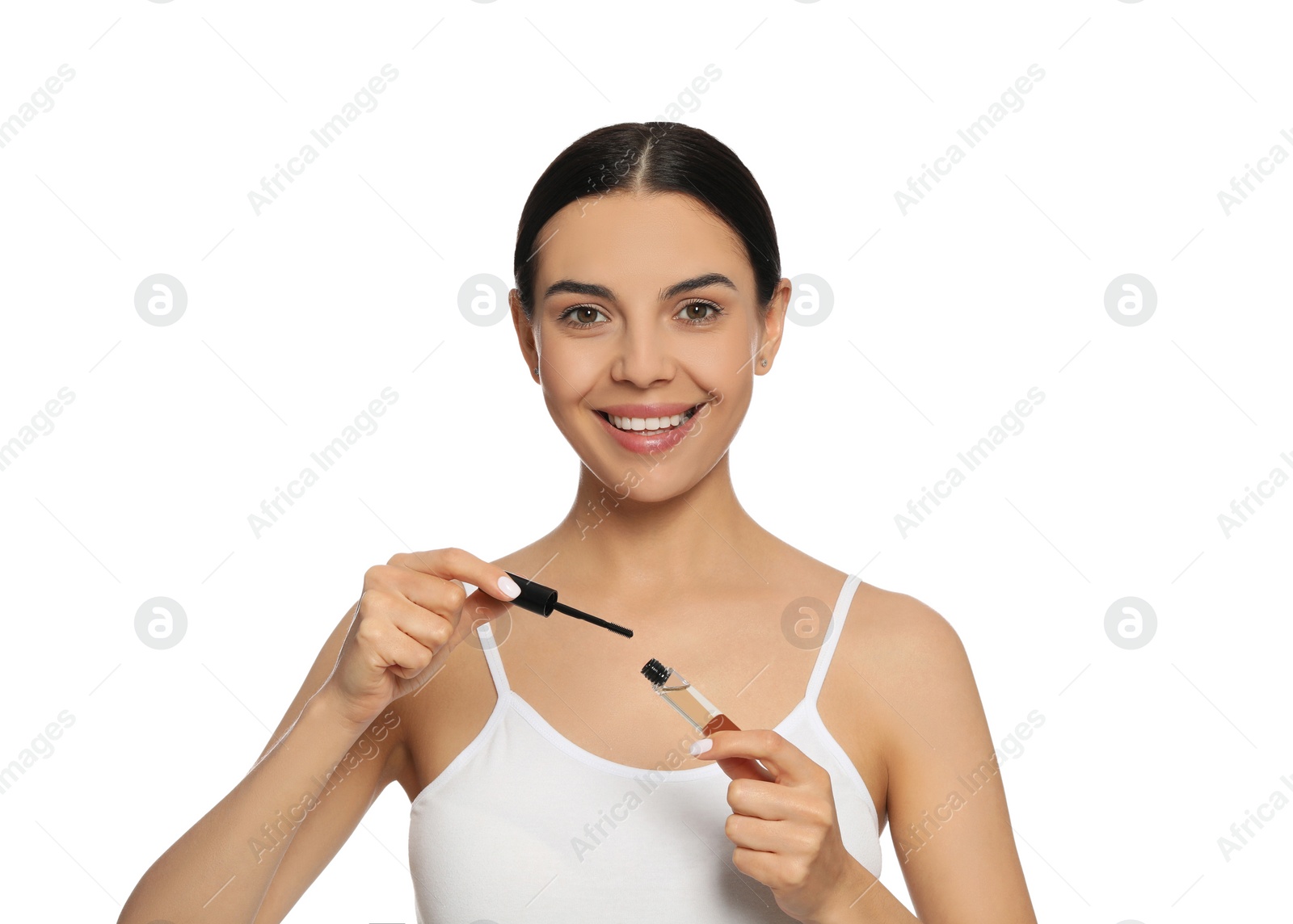 Photo of Young woman with eyelash oil on white background