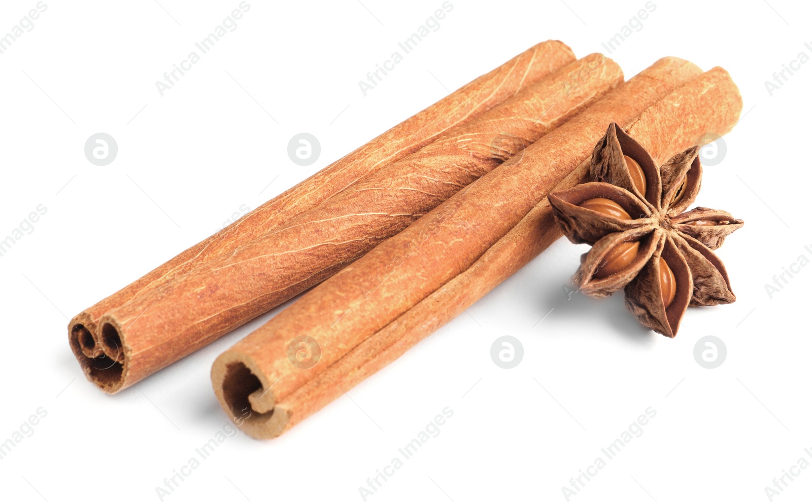 Photo of Cinnamon sticks and anise star isolated on white