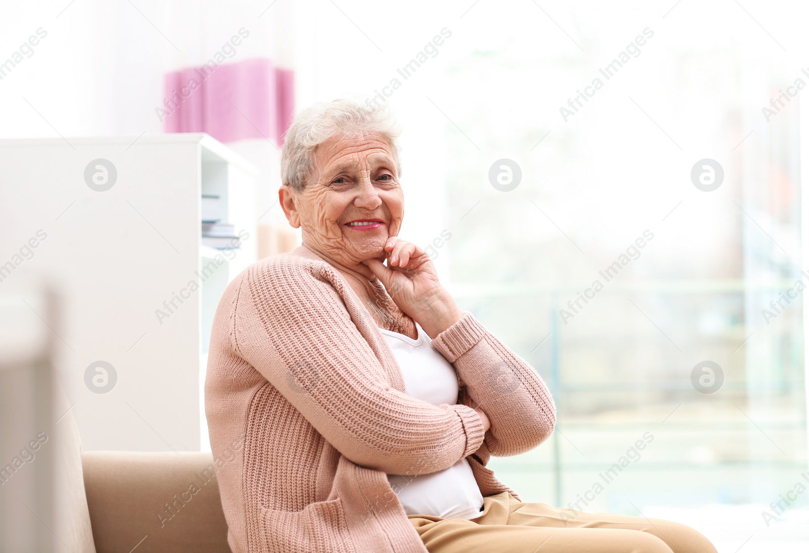 Photo of Portrait of beautiful grandmother in living room