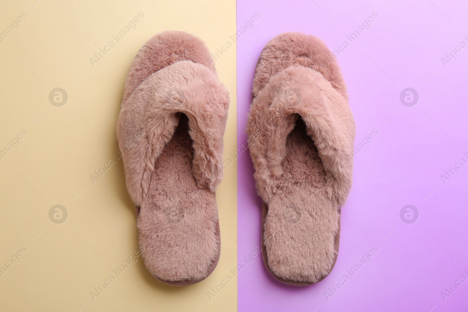 Photo of Pair of stylish soft slippers on color background, flat lay