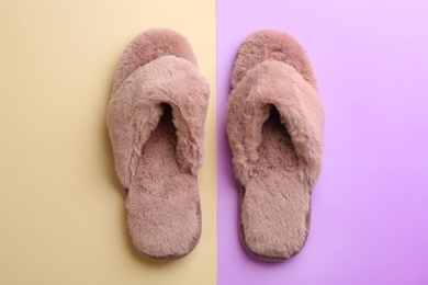 Photo of Pair of stylish soft slippers on color background, flat lay