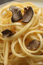 Photo of Closeup view of tasty fettuccine with truffle