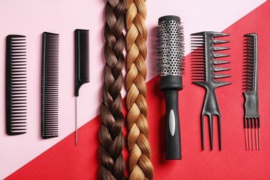 Photo of Flat lay composition with hair salon tools on color background