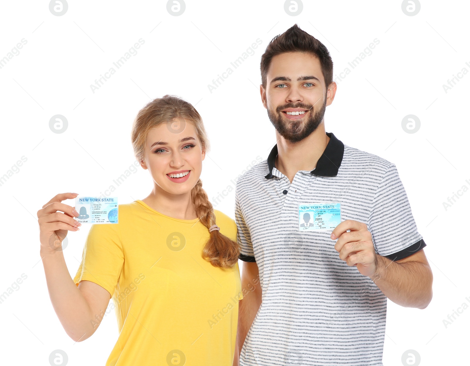 Photo of Happy young people with driving licenses on white background