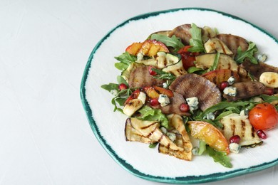 Delicious salad with beef tongue, grilled vegetables, peach and blue cheese on white table, closeup. Space for text