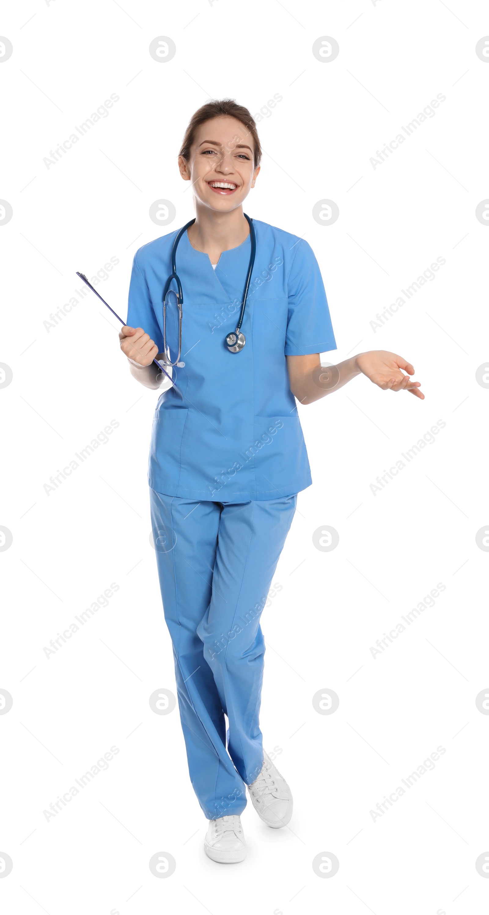 Photo of Full length portrait of medical doctor with clipboard isolated on white