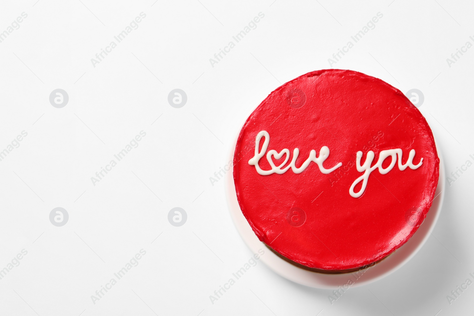 Photo of Bento cake with text Love You and space for text on white table, top view. St. Valentine's day surprise