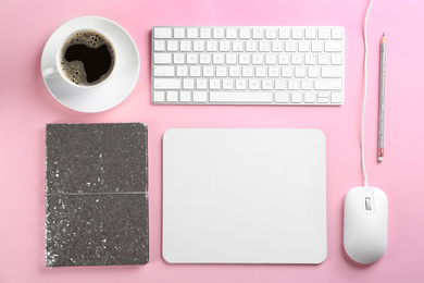 Flat lay composition with mouse and cup of coffee on pink background