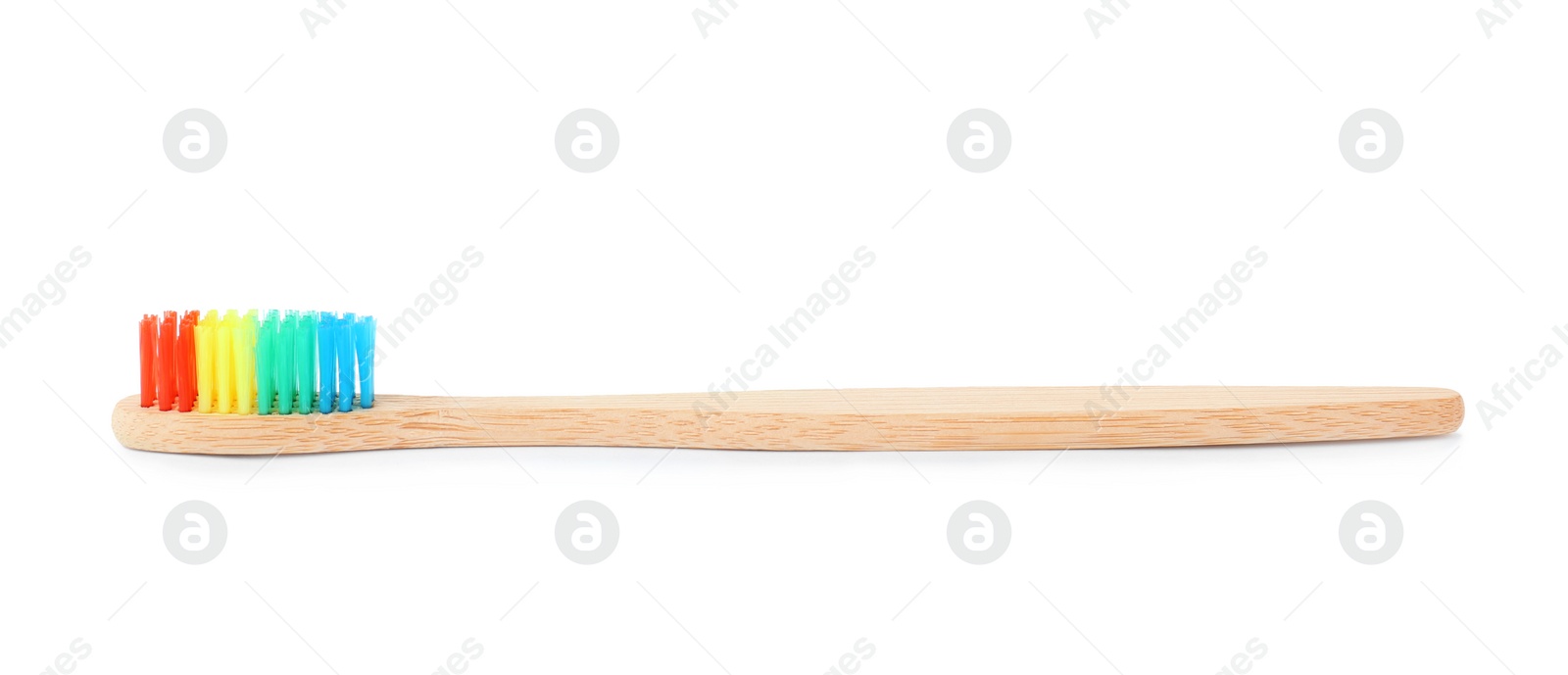 Photo of Bamboo toothbrush on white background. Dental care