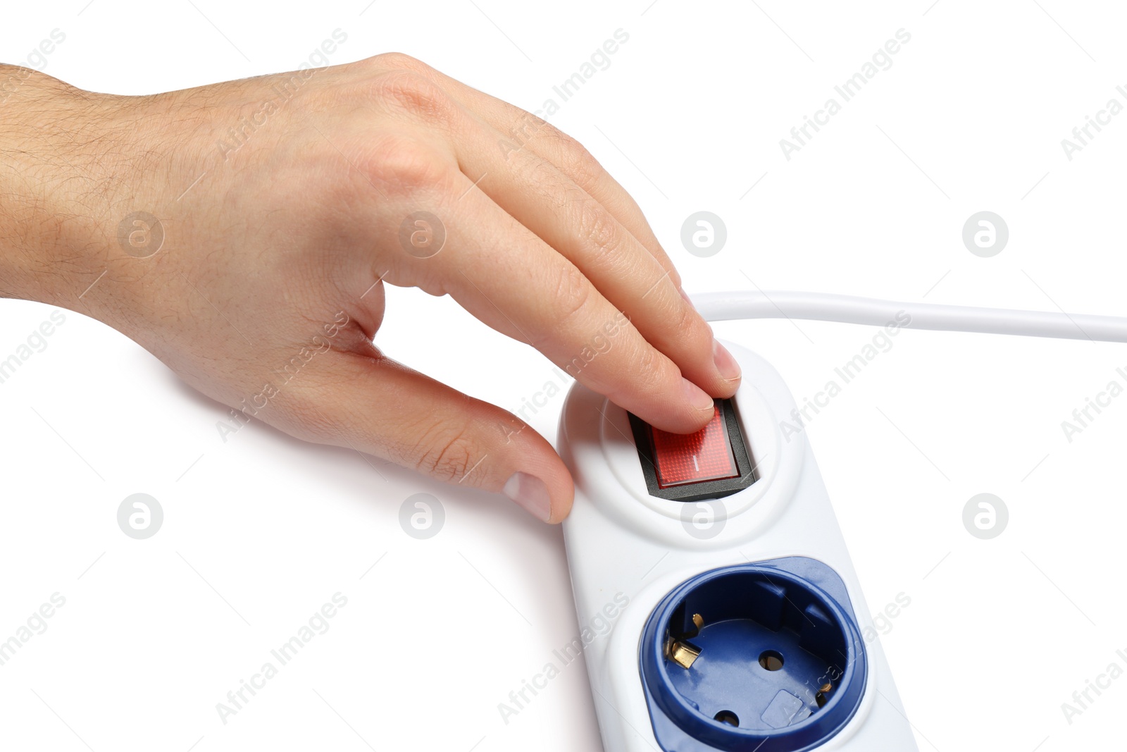 Photo of Man pressing power button of extension cord on white background, closeup. Electrician's professional equipment