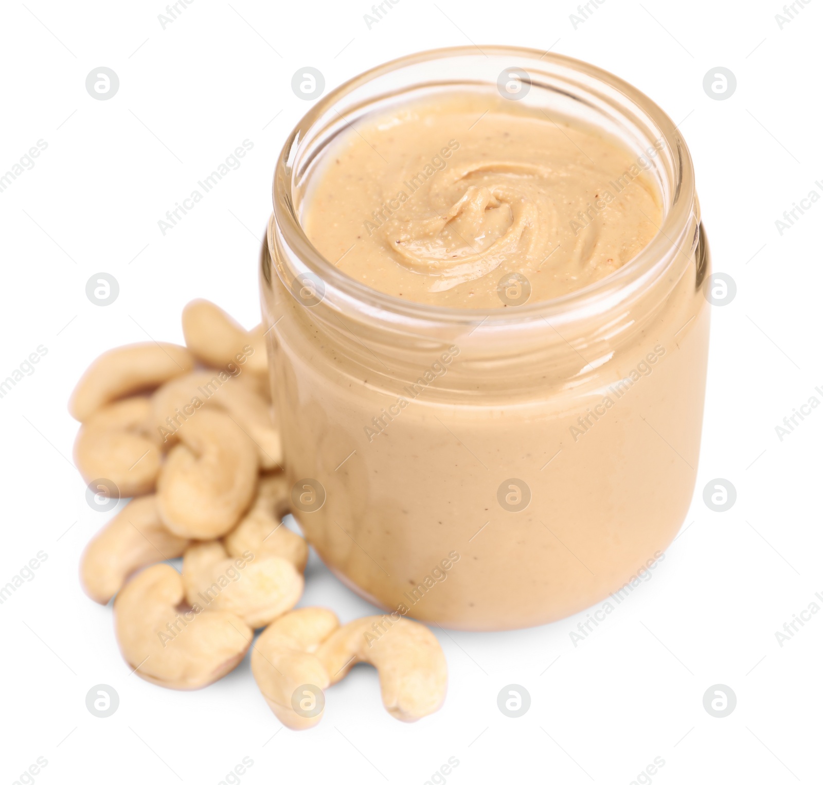 Photo of Tasty nut paste in jar and cashews isolated on white