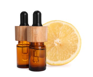 Bottles of citrus essential oil and fresh lemon isolated on white