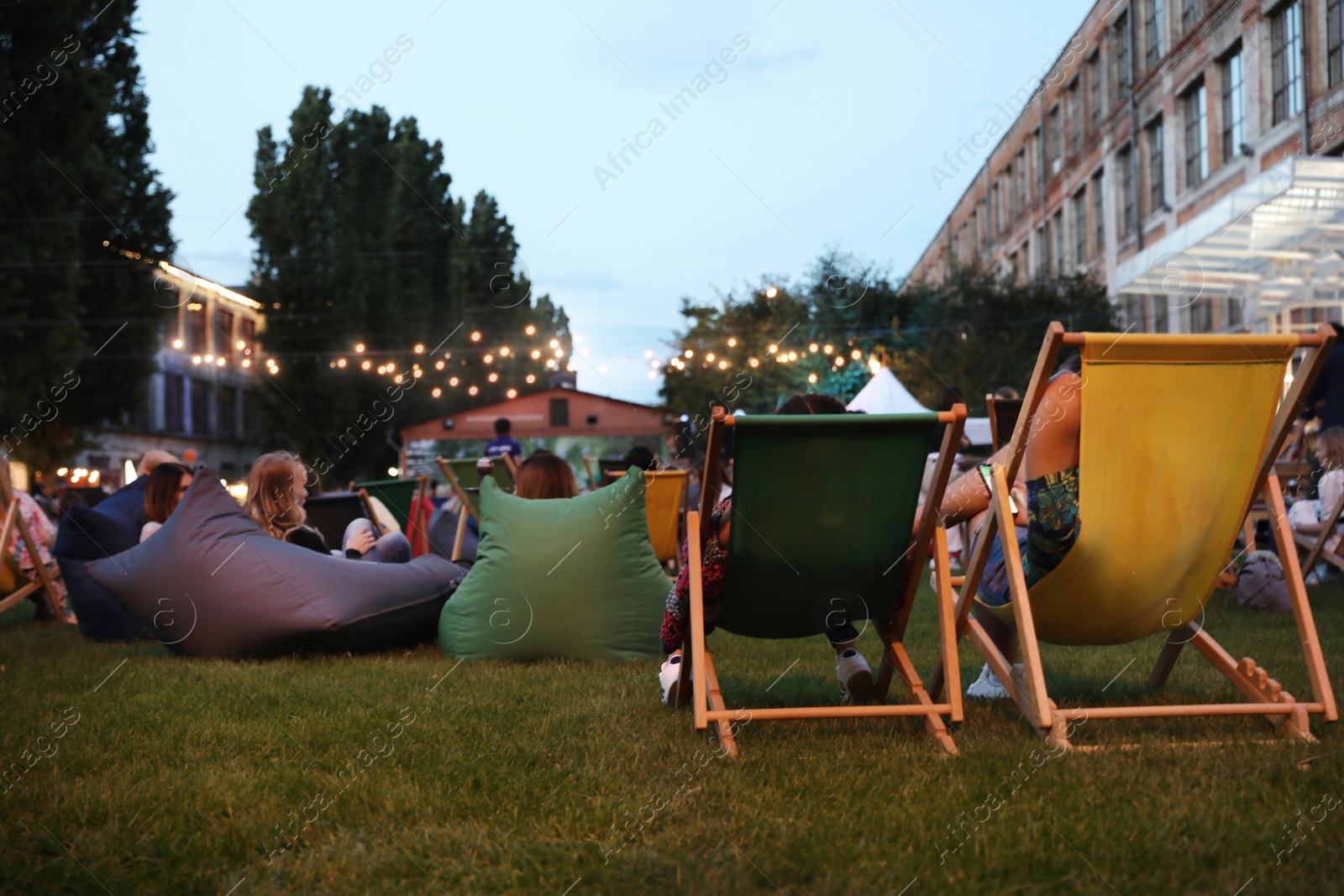 Photo of Modern open air cinema with comfortable seats in public park