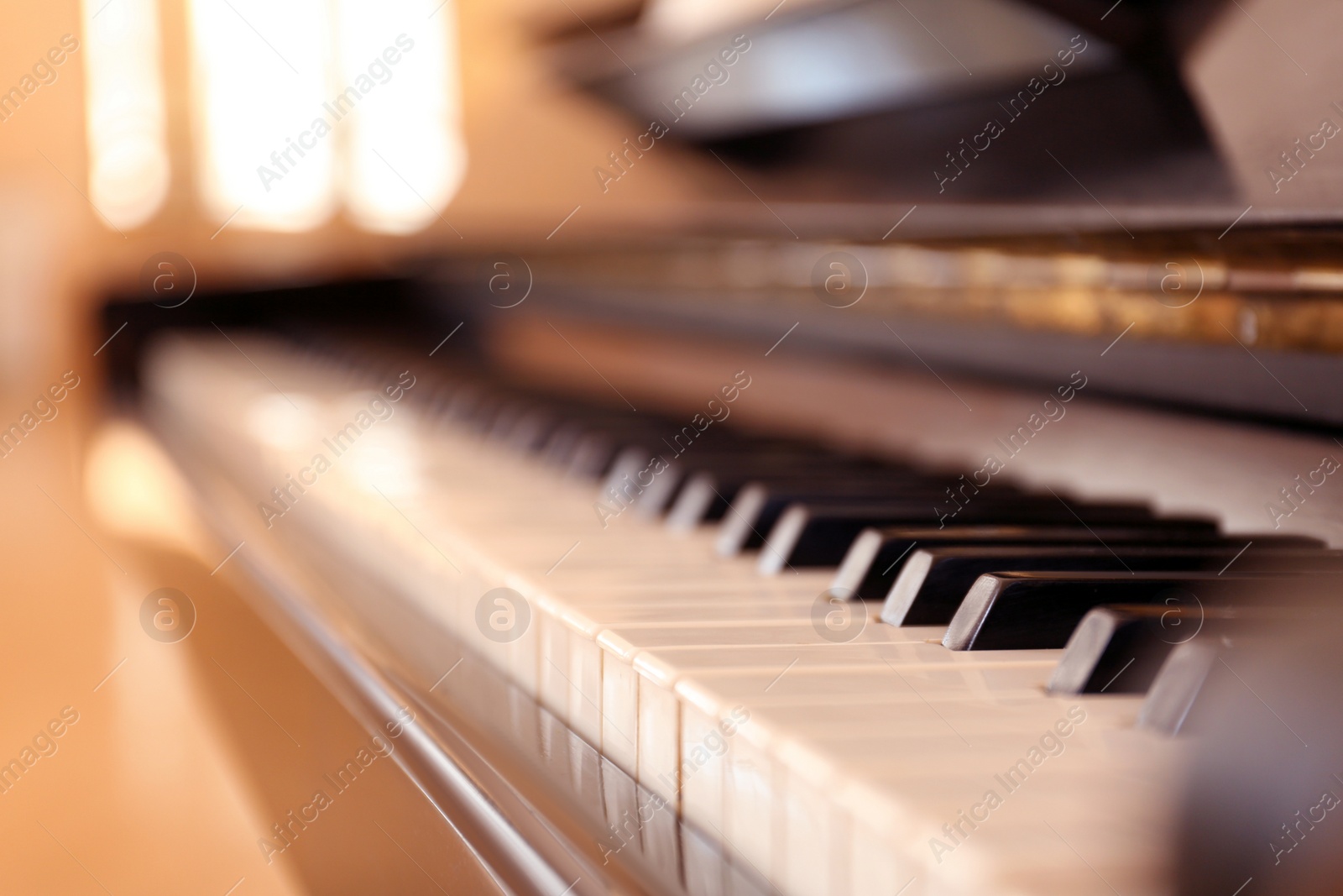 Photo of Black and white piano keys indoors, closeup