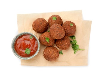 Photo of Delicious falafel balls, sauce and parsley on white background, top view. Vegan meat products