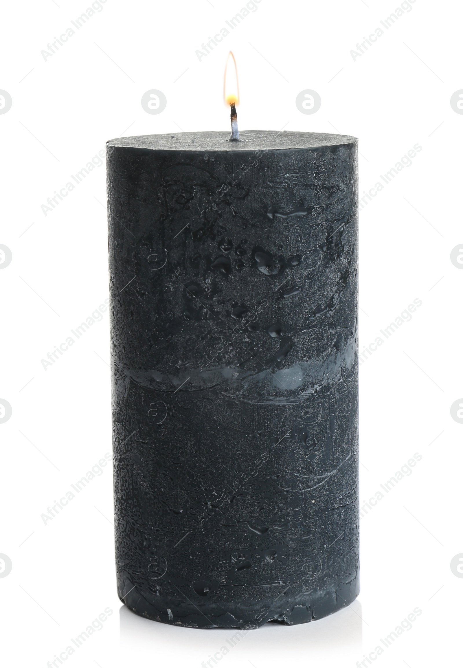 Photo of Dark burning decorative candle isolated on white