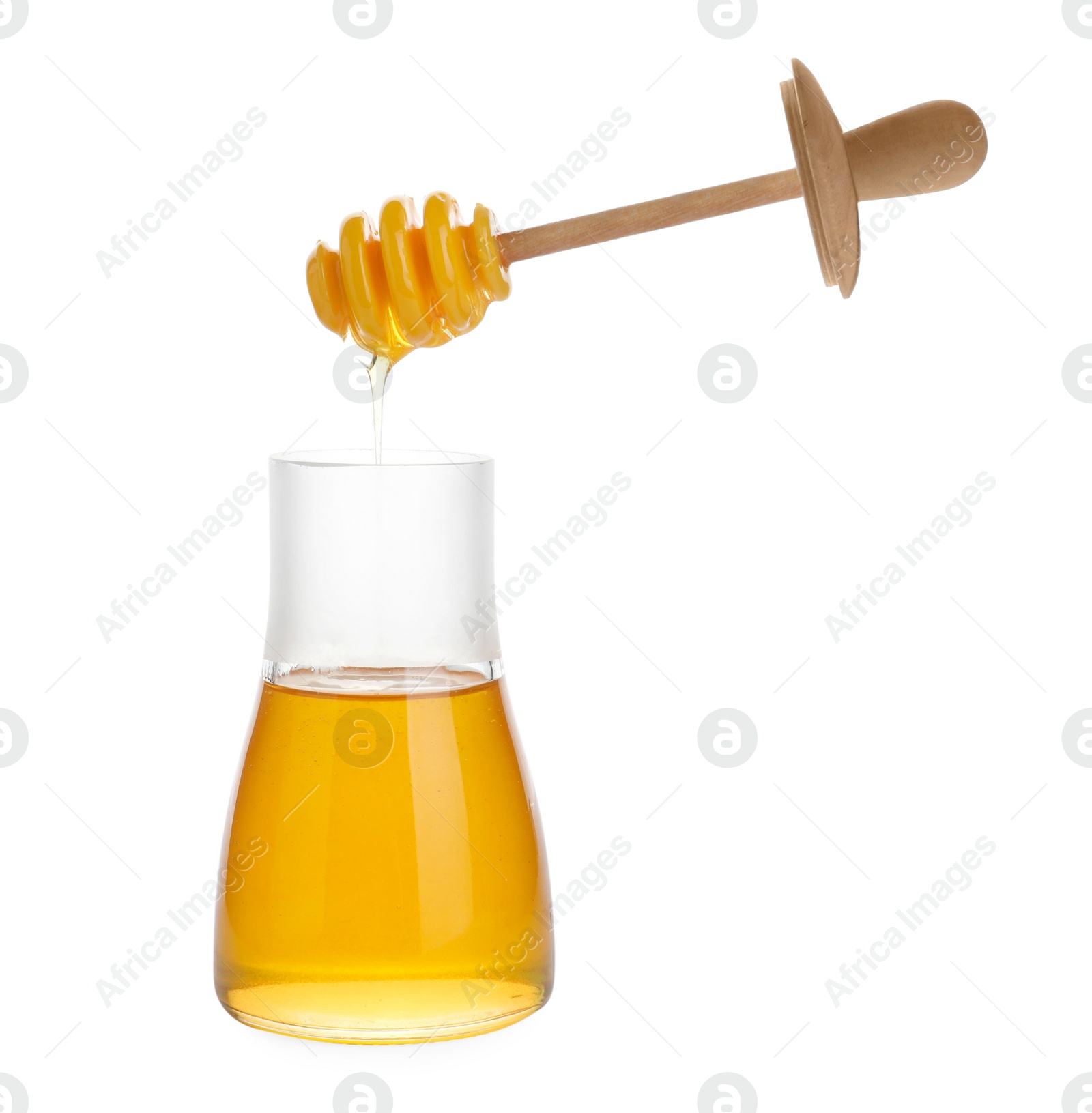 Photo of Glass jar of sunflower honey and wooden dipper isolated on white