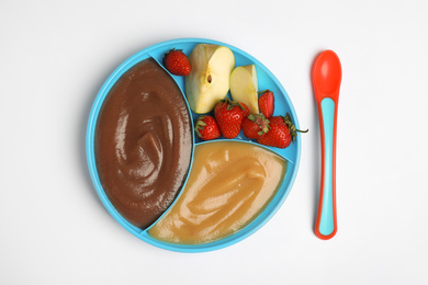 Photo of Healthy baby food with ingredients and spoon on white background, flat lay