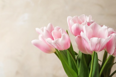 Beautiful tulips for Mother's Day on light background