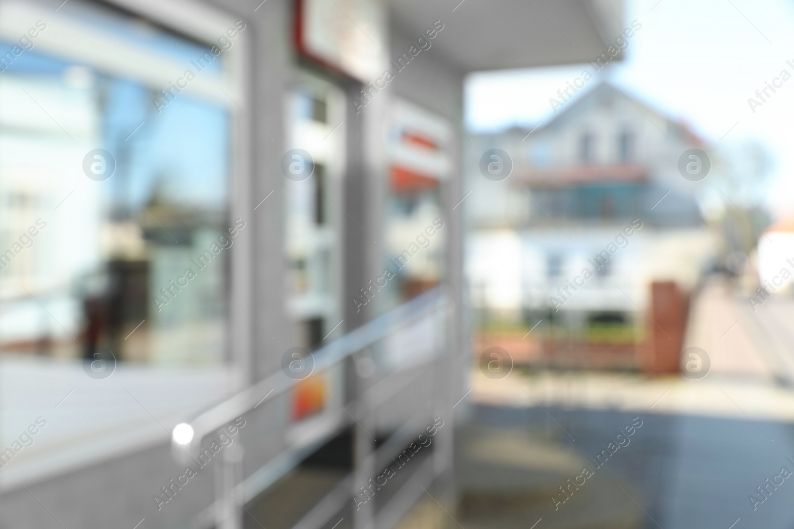 Photo of Blurred view of store exterior and city street. Bokeh effect