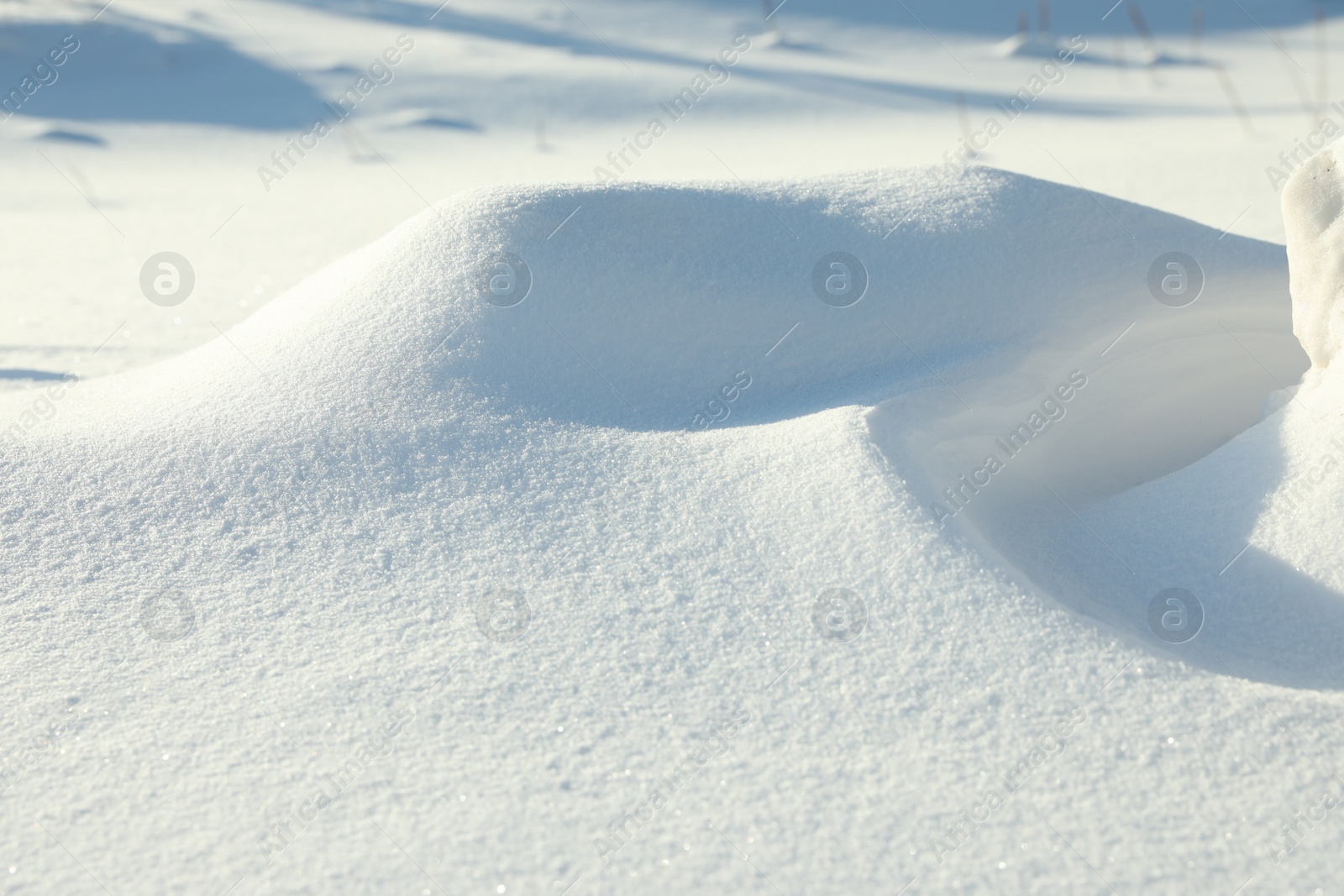 Photo of Beautiful snowdrift as background, closeup view. Winter weather